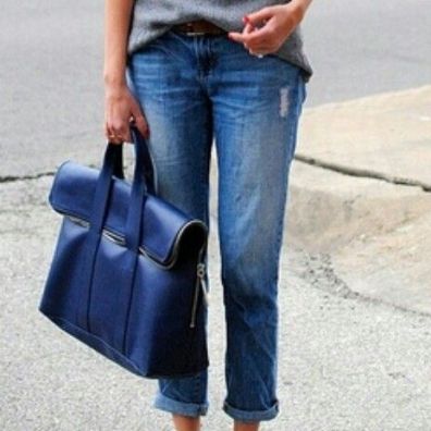 Slouchy boyfriend jeans paired with the right heels and sweater are strikingly flattering